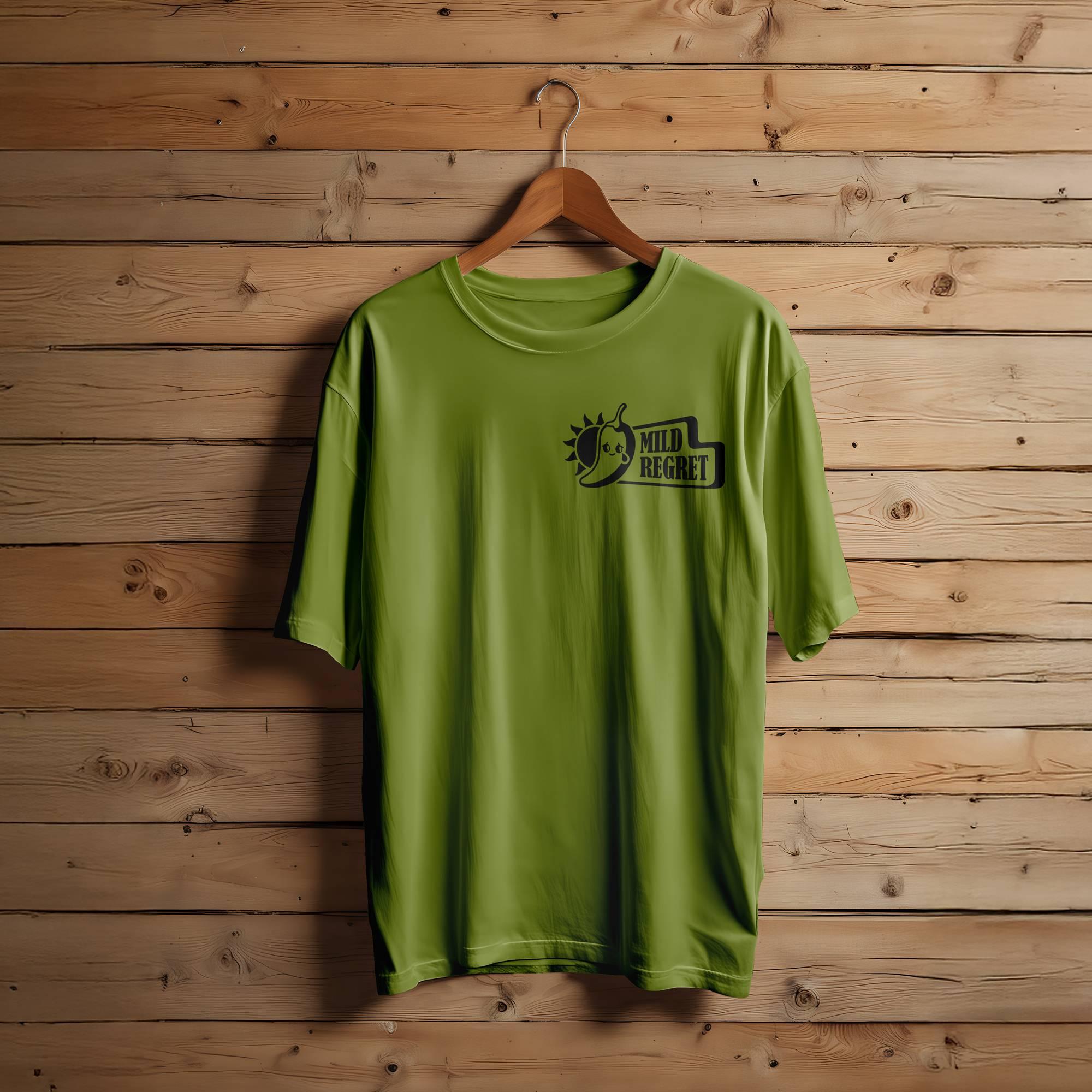 A green T-shirt featuring the Mild Regret logo in the upper corner.